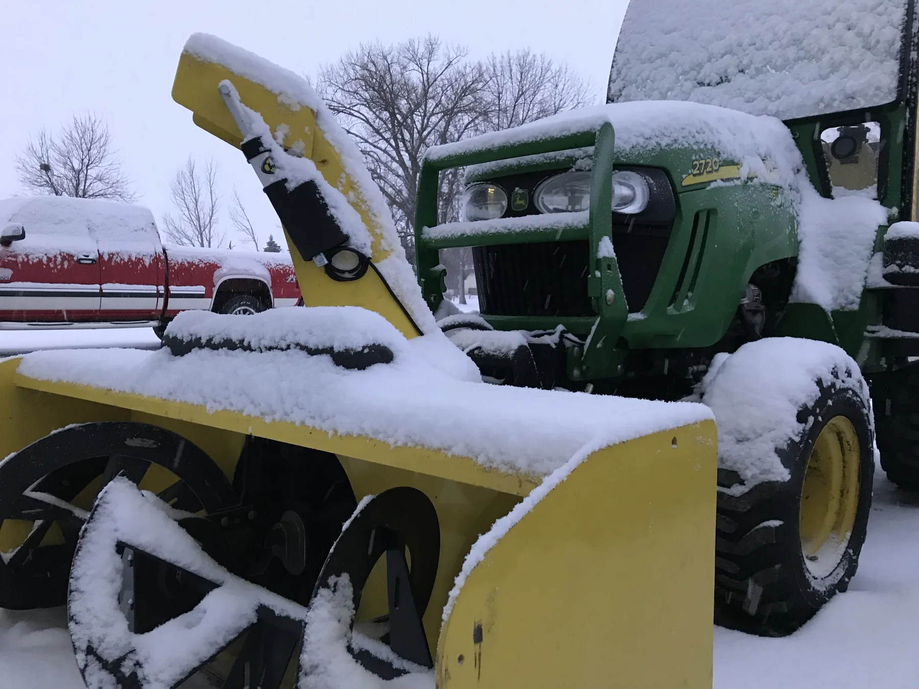 Close-up of a tractor-mounted inverted snowblower used on Baker Snow & Ice routes